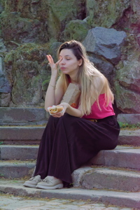 Girl with a sandwich relaxing